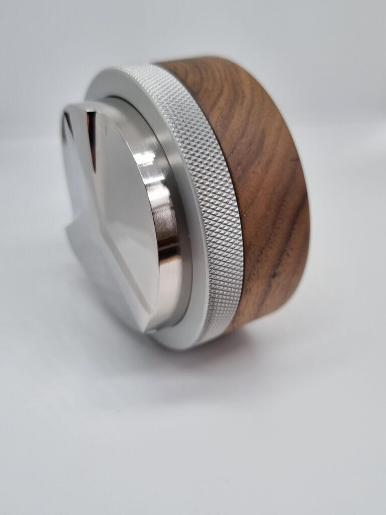 Hauck Leveler Competition-Line V5 with walnut wood and stainless steel finish, showcasing high precision craftsmanship.