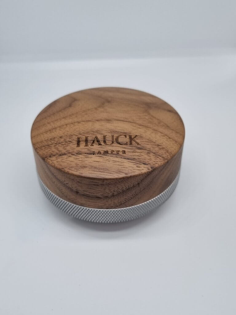 Hauck Leveler Competition-Line V5 with walnut wood and stainless steel finish, showcasing high precision craftsmanship.