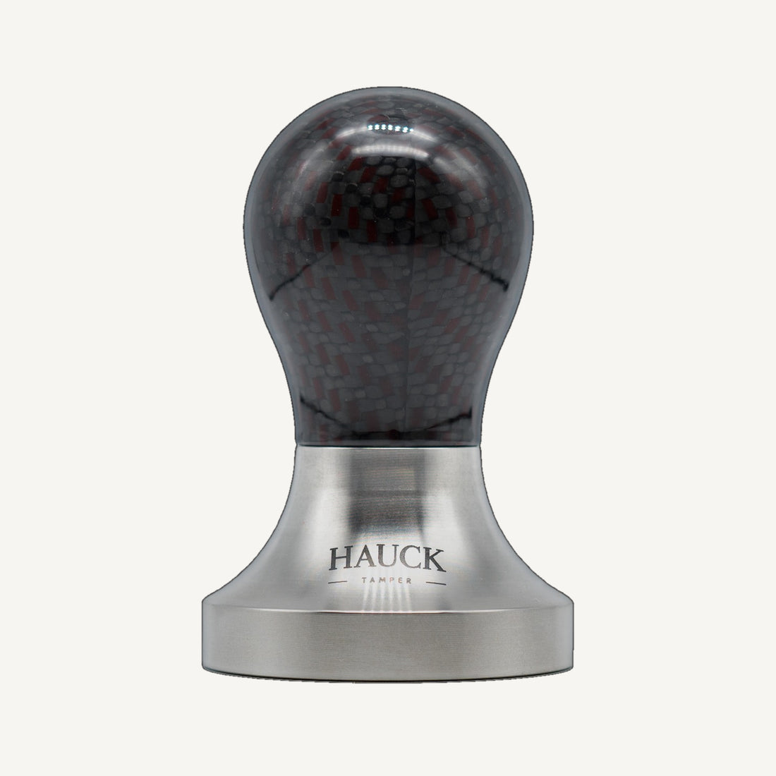 Hauck Tamper Premium Line Rune Kona Carbon red grid Limited Edition – Frontansicht auf einheitlichem Off-White-Hintergrund