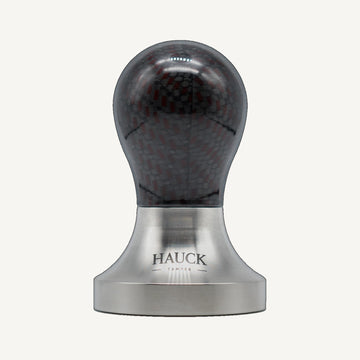 Hauck Tamper Premium Line Rune Kona Carbon Red Grid Limited Edition – front view against a uniform off-white background